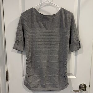 Gray short sleeve sweater.